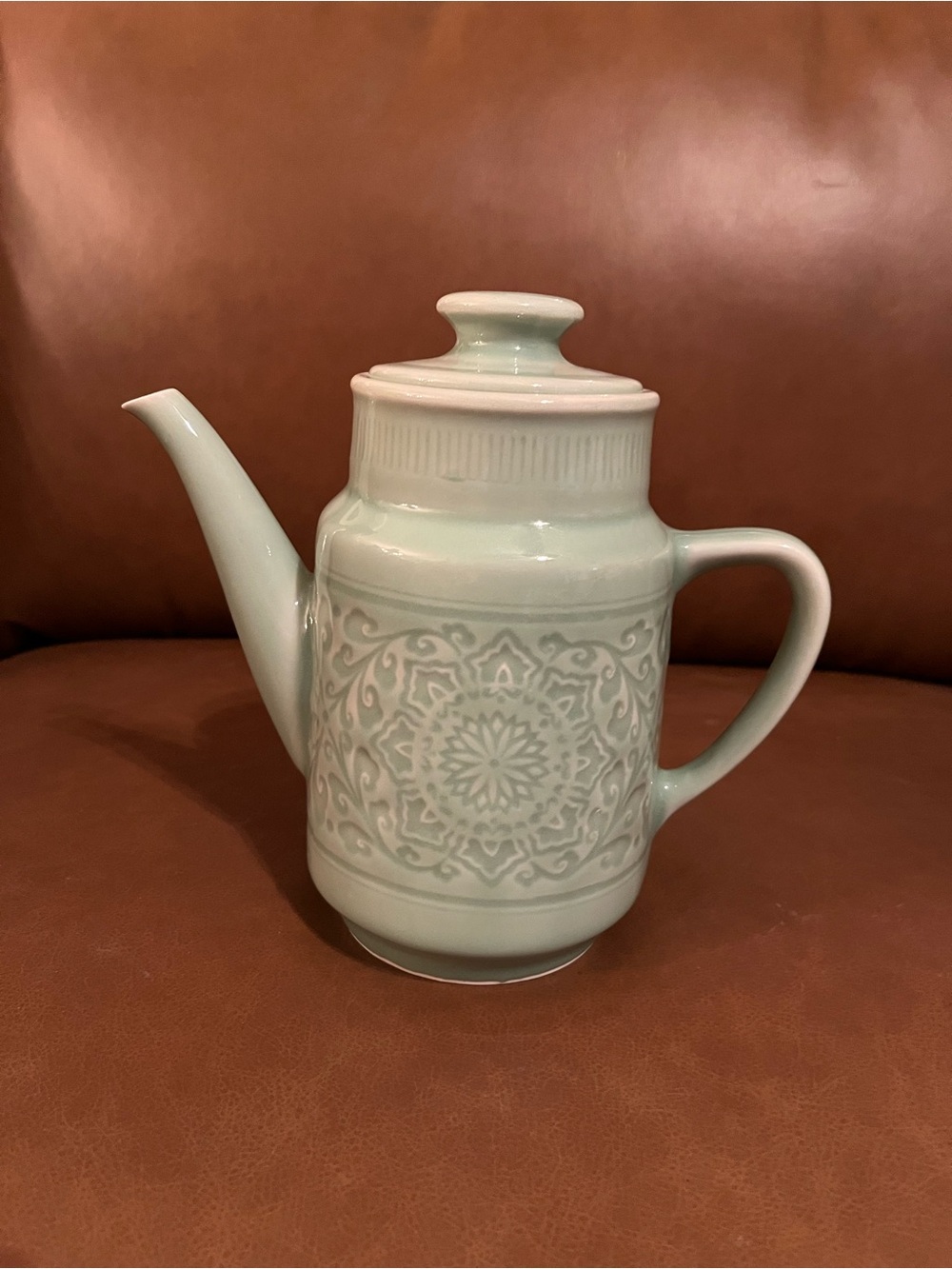 Light Green Celadon Ceramic Teapot with Embossed Floral Design